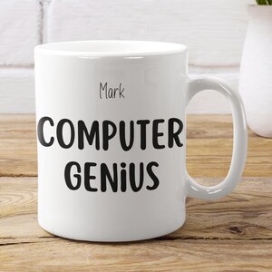 May include: White ceramic mug with black text that reads "Mark Computer Genius".