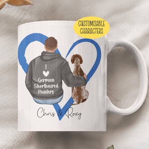 May include: White ceramic mug with a blue heart design. The heart features a cartoon illustration of a person and a dog. The text "I love German Shorthaired Pointers" is printed on the mug. The names "Chris & Roxy" are written below the heart.