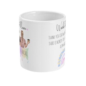 May include: White ceramic mug with a colorful illustration of two women holding coffee cups. The text "Work it Mum" is written on the mug with a pink heart. The text "Thank you for always being there is nobody like you as my Mum" is written on the mug.