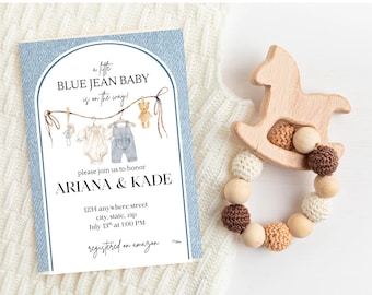 May include: A baby shower invitation with the text "a little BLUE JEAN BABY is on the way!" and a wooden rocking horse-shaped teether with crochet and wooden beads.