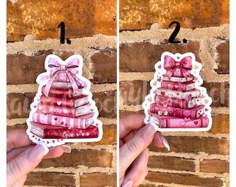 Pegatina de pila de libros rosa