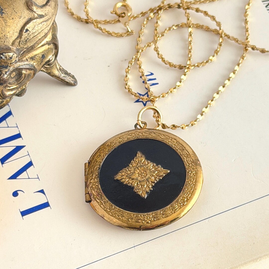 Vintage Black Enamel Round Locket With Repoussé Gold‑tone Floral Detail ...