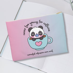 May include: A pink and blue zippered pouch with a cute panda bear illustration. The panda is wearing a pacifier and is inside a blue coffee cup. The text on the pouch reads "never too young for caffeine neonatal intensive care unit".