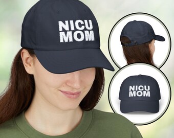 May include: A navy blue baseball cap featuring the white text "NICU MOM". The cap has a curved peak and an adjustable strap at the back. Additional views of the cap are shown in the image.