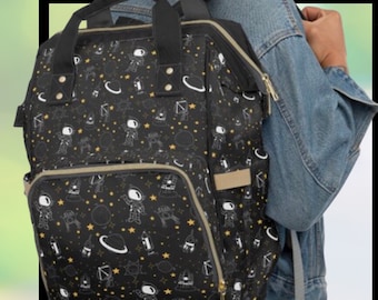 Mochila para pañales de bebé, bolsa negra, blanca, con astronauta, espacio exterior, multiusos, sistema solar, para uso diario, vacaciones, viajes, bolsa para pañales y artículos para bebé