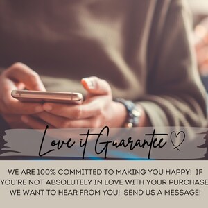 May include: A person is holding a smartphone with a blurred background. The text "Love it Guarantee" is written in a white box with a heart symbol.