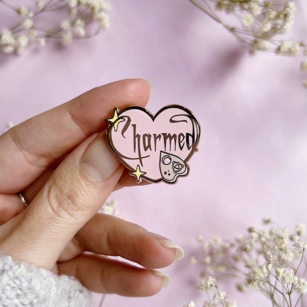 Charmed heart pin