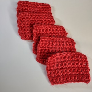 May include: Five red crocheted squares stacked on top of each other. The squares are made with a single crochet stitch.