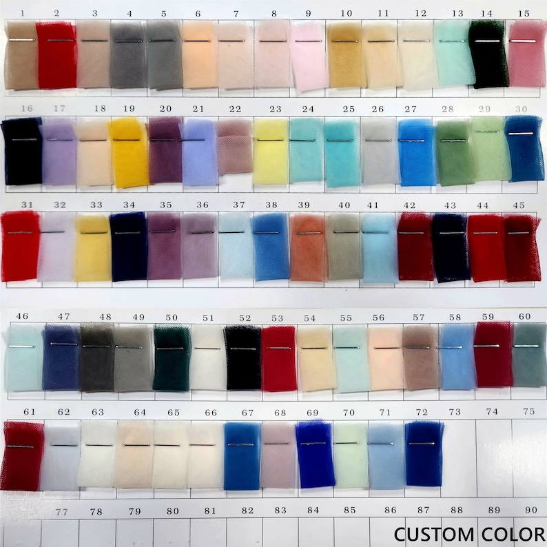 May include: A color chart with 90 different shades of tulle fabric. The chart is numbered from 1 to 90. The fabric is arranged in rows of 10. The chart is labeled "CUSTOM COLOR" at the bottom.