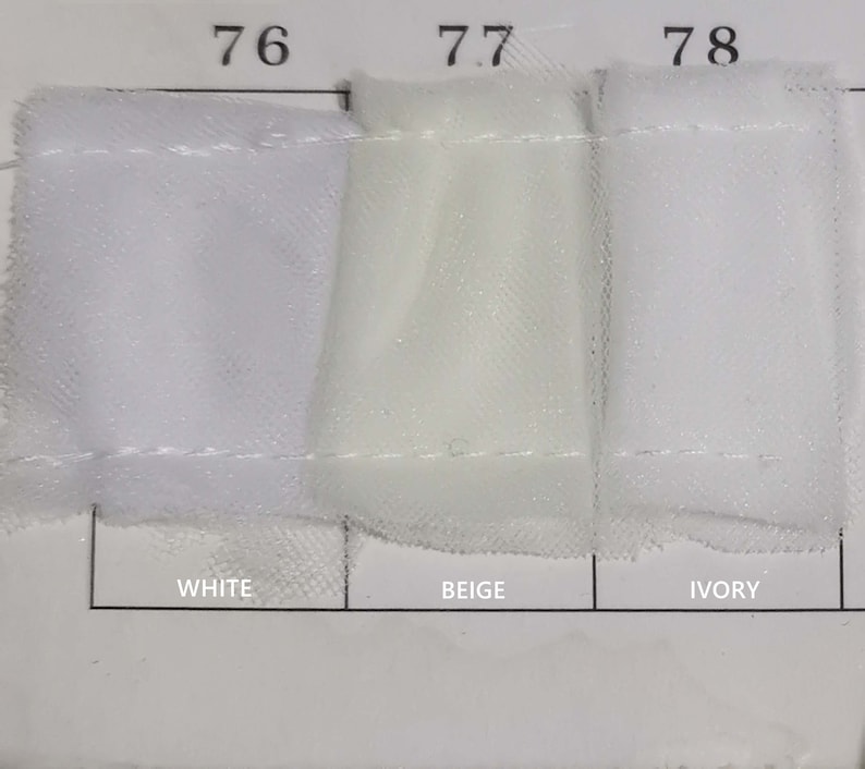 May include: Three fabric swatches labeled "76 White", "77 Beige", and "78 Ivory".