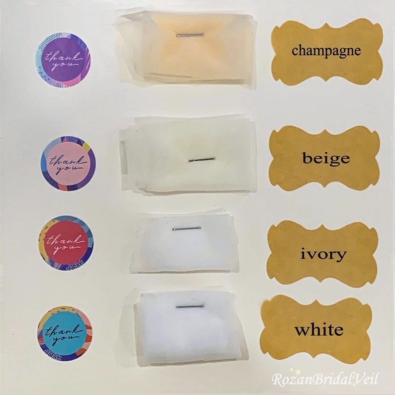 May include: Four swatches of tulle fabric in different colors: champagne, beige, ivory, and white. Each swatch is labeled with the color name and has a small pin attached to it.