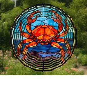 May include: A stained glass window design featuring a red crab with blue and green accents. The crab is surrounded by a black metal frame with a decorative pattern.