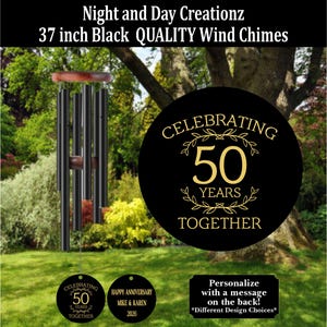 May include: Black wind chimes, 37 inches long, with a wooden top and accents. The chimes have a round black emblem that says "Celebrating 50 Years Together." Additional tags read "Happy Anniversary Mike & Karen 2026."