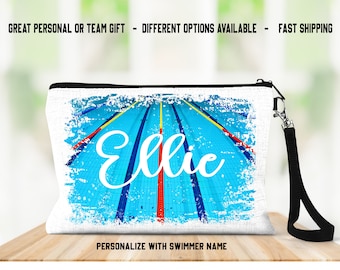 May include: A white rectangular zippered pouch with a wrist strap featuring a graphic print of a blue swimming pool with lane markers and the name Ellie in white script text. The text GREAT PERSONAL OR TEAM GIFT - DIFFERENT OPTIONS AVAILABLE - FAST SHIPPING and PERSONALIZE WITH SWIMMER NAME are visible.