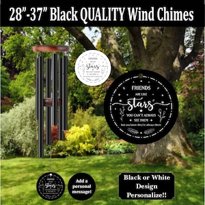 May include: Black wind chimes with a wooden top and bottom, featuring a circular hanging plaque with the text 'FRIENDS ARE LIKE stars YOU CAN'T ALWAYS SEE THEM but you know they're always there' and a smaller matching white circular plaque.
