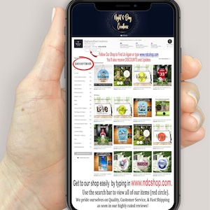 May include: A smartphone displaying an Etsy shop page, held by a hand. The shop's name is "Night and Day Creationz." Text on the screen includes "SEARCH SHOP ITEMS HERE" and shop details. The shop sells various items.