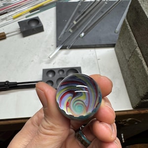 Vortex marble w/ teal backing