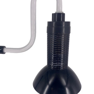 a black lamp with a white cord attached to it