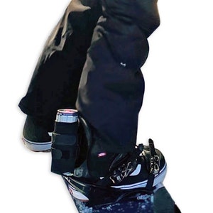 Tall Skinny Can Attached to Snowboarder's Binding Highback