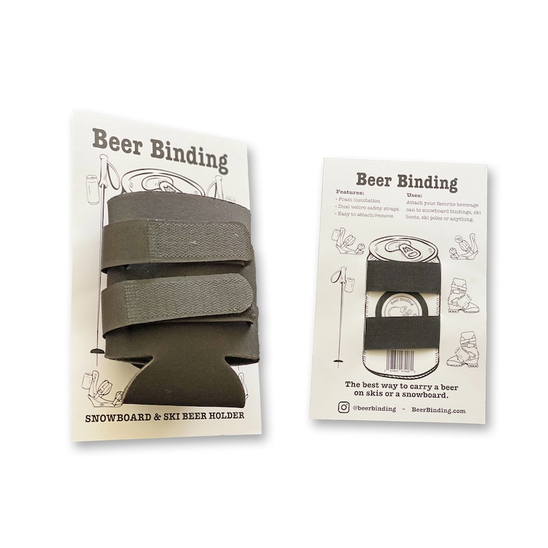 May include: Two product packaging cards for a beer holder called "Beer Binding". The left card shows a black and grey beer holder with the text "Snowboard & Ski Beer Holder". The right card shows a black and grey beer holder attached to a can of beer with the text "The best way to carry a beer on skis or a snowboard." and the social media handles "@beerbinding" and "BeerBinding.com".