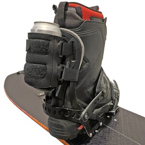 Beer Binding Strapped to Snowboard Binding Highback