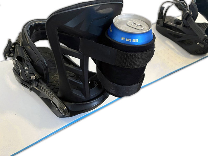 Beer Strapped to Snowboard Binding