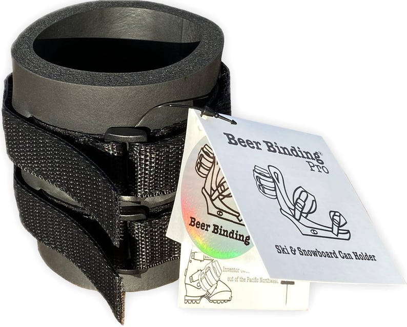 May include: Black foam can holder with adjustable straps and a white label that reads "Beer Binding Pro" and "Ski & Snowboard Can Holder".