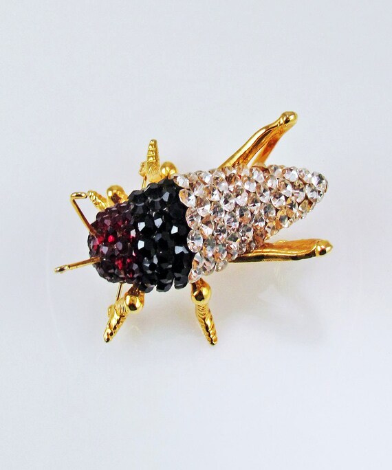 Broche vintage dorée et argentée avec strass yeux de chien de Broche vintage dorée et argentée avec strass yeux de chien de
