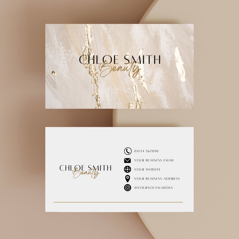 May include: A white business card with gold accents featuring the text "CHLOE SMITH Beauty" and contact information including a phone number, email address, website, business address, and social media handle.