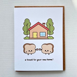 Un toast pour votre nouvelle maison, jolie carte de voeux de pendaison de crémaillère