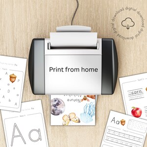 May include: Printable alphabet worksheets for kids featuring the letter 'A' with a nature theme. The worksheets include tracing, finding the letter, and making the letter activities. The image shows a printer with the worksheets in the tray.
