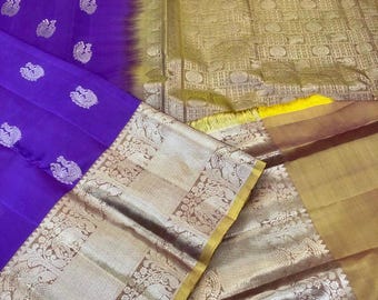 kss313 pure kanjivaram silk saree in purple w/ wide zari border. fall peco done. stitched blouse size: 38 to 46. silk mark certified