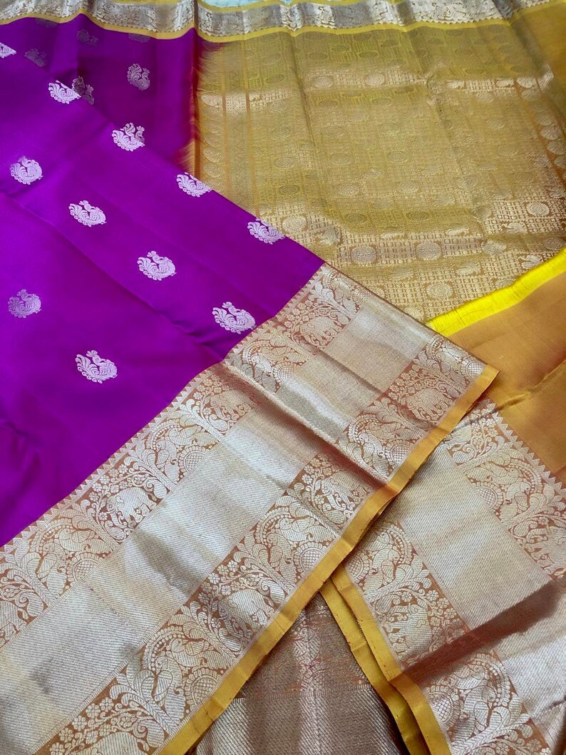 Banarasi Tussari saree in Red with Green  border. Fall peco done. Comes with stitched blouse size 38 can be altered up to 44 size.