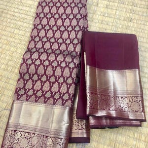 kss308 equisite kanjivaram pure silk brocade saree in maroon. fall peco done. comes with stitched blouse size: 38 to 46. silk mark certified