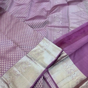 KSS305 Equisite Kanjivaram Pure Silk Brocade Saree In Mauve. Fall Peco done. Comes with stitched blouse size: 38 to 46. SILK MARK CERTIFIED