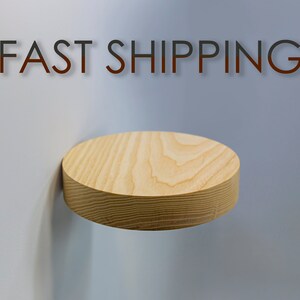 May include: A round wooden shelf with the text "FAST SHIPPING" on a light blue wall.