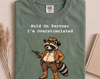 Comfort Colors® Hold On Partner I'm Overstimulated Shirt, Funny Fat Raccoon Tee, Cowboy Raccoon Western Shirt, Raccoon Lover , Retro 90s Tee