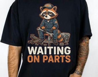 Comfort Colors® Waiting on Parts Mechanic T-Shirt, funny auto technician gift, skeleton garage humor graphic tee, funny raccoon shirt