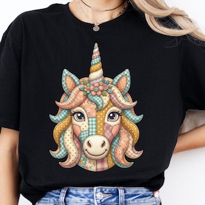 May include: Black t-shirt featuring a colorful unicorn face design. The unicorn has a patchwork pattern with pastel colors, a spiral horn, and a floral crown. The design is whimsical and detailed.