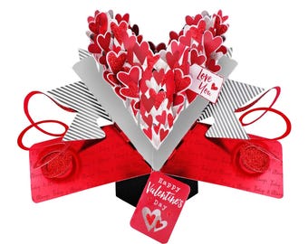 May include: A red and white pop-up card with a heart-shaped design. The card features a 3D pop-up of a heart filled with smaller hearts. The card reads "Happy Valentine's Day" and "Love You".