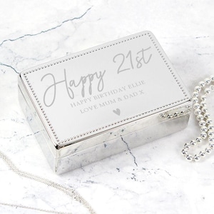 May include: Silver jewelry box with a white engraved message that reads "Happy 21st Happy Birthday Ellie Love Mum & Dad X".