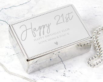 May include: Silver jewelry box with a white engraved message that reads "Happy 21st Happy Birthday Ellie Love Mum & Dad X".