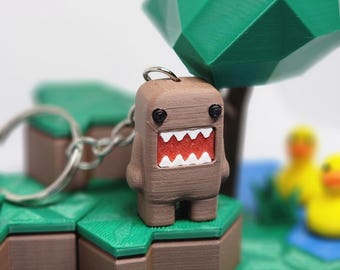 Mini llavero con dije de Dommy el Monstruo: ¡un lindo regalo para los pequeños monstruos que amas!