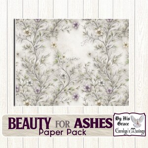 May include: A floral paper pack with a soft, watercolor-like design. The artwork features delicate vines, leaves, and flowers in shades of white, cream, and purple. The text "BEAUTY FOR ASHES Paper Pack" is displayed at the bottom.