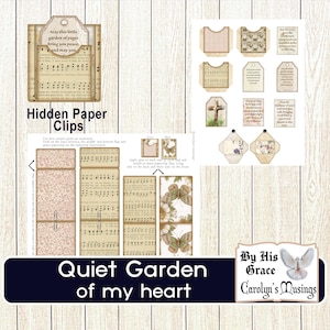 May include: A collection of paper ephemera with a vintage aesthetic. The set includes tags, pockets, and hidden paper clips, all featuring musical notes, floral patterns, and inspirational quotes. The words "Quiet Garden of my heart" are visible.