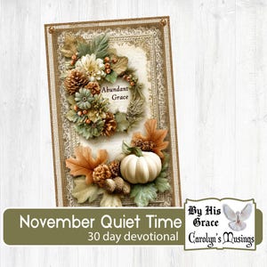 May include: A decorative card with a fall theme. It features a wreath of flowers, leaves, and pinecones, with a small white pumpkin. The text "Abundant Grace" is visible. The card also includes the text "November Quiet Time 30 day devotional".