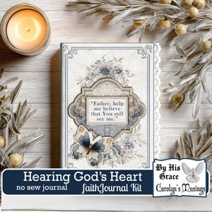 Könnte beinhalten: Ein dekoratives Journal mit floralem und Schmetterlingsdesign. Der Einband zeigt das Zitat: „Vater, hilf mir zu glauben, dass Du mich noch siehst.“ Teil eines „Hearing God's Heart“ Glaubensjournal-Kits.