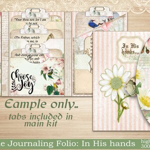 May include: A pink and white Bible journaling folio with a daisy and butterfly design. The folio has tabs with the text "Fear thou not; for I am he not", "My Father, which love me, is", "And even to your old age, I am He; and your hairs", and "Choose Joy". The folio also has a pink and white striped cover with the text "In His hands..."