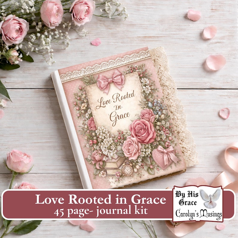 A Faith journal kit with a pink cover featuring the text "Love Rooted in Grace" surrounded by floral illustrations and a bow. The journal has a lace trim and is set against a backdrop of flowers and petals.