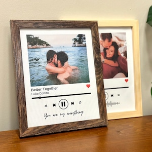 May include: A framed print featuring a photograph of a couple in the water. The print is styled to resemble a music player with the song title "Better Together" by Luke Combs. The text "You are my everything" is written beneath the music player.